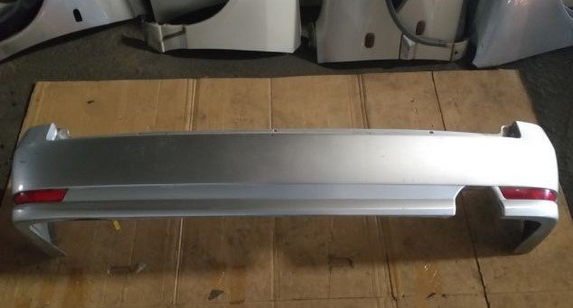 Paragolpe envolvente trasero Nissan Wingroad